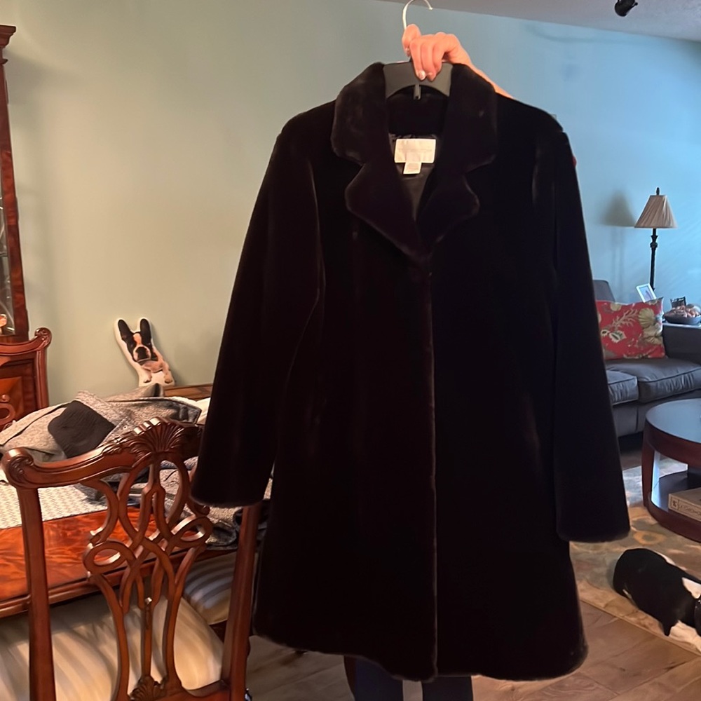 Short fur, knee length womens dress coat.